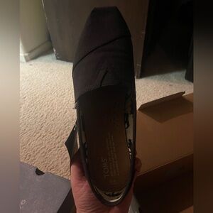 TOMS black slip-ons